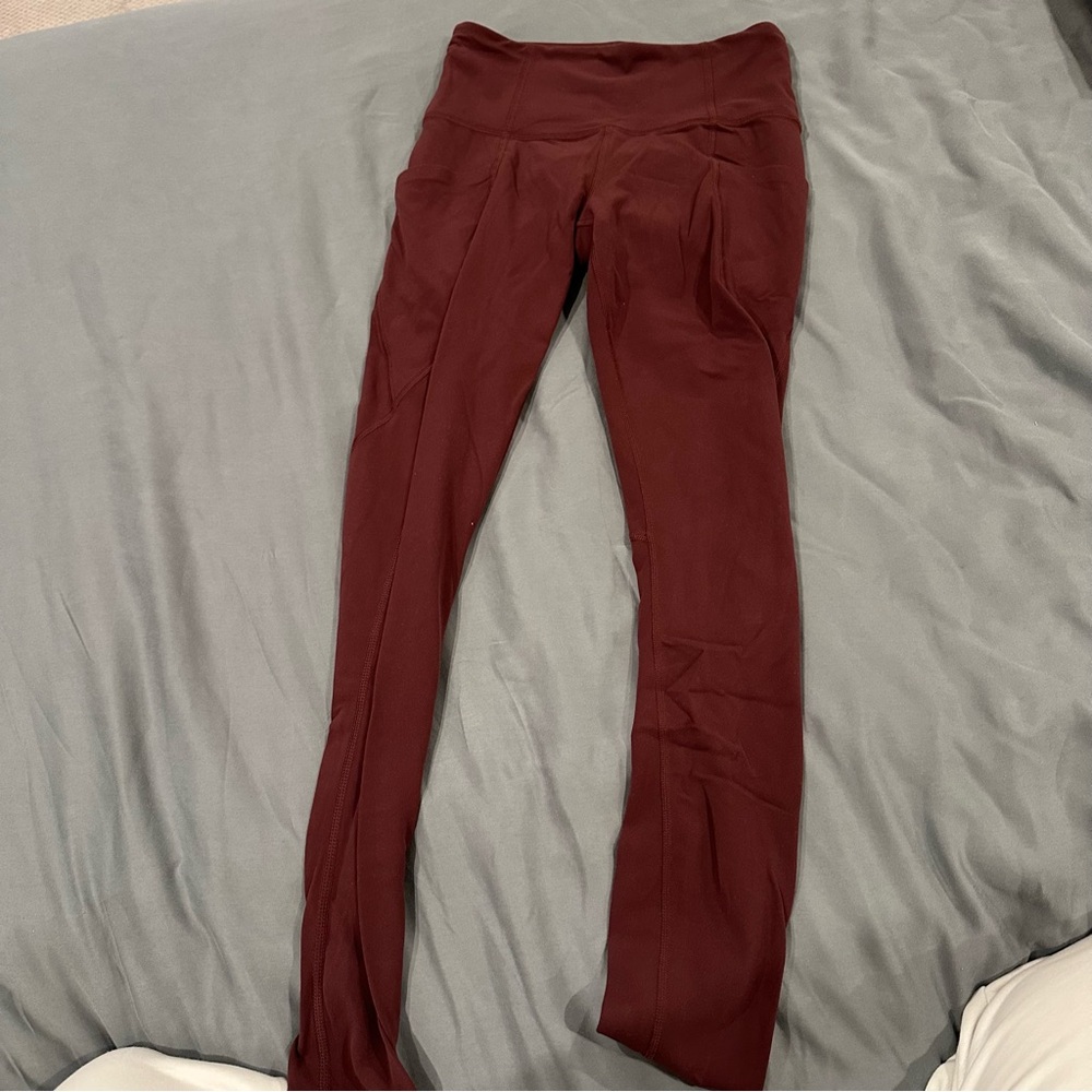 Athleta Burgundy Salutation Stash Leggings